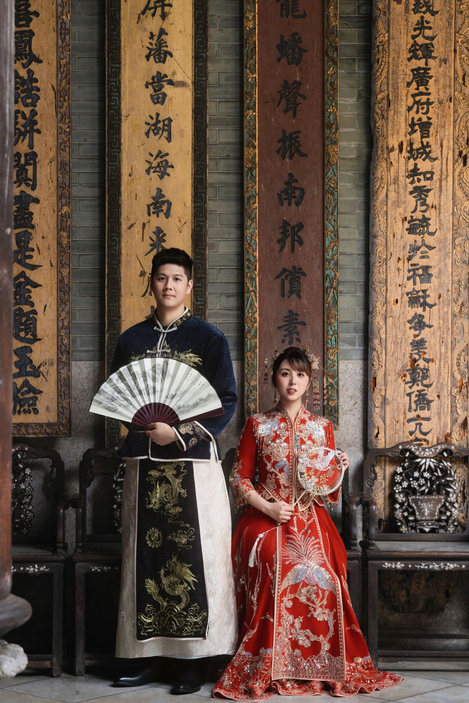Classic wedding photography featuring a bride and groom in authentic traditional Chinese wedding attire at Pinang Perankan Mansion