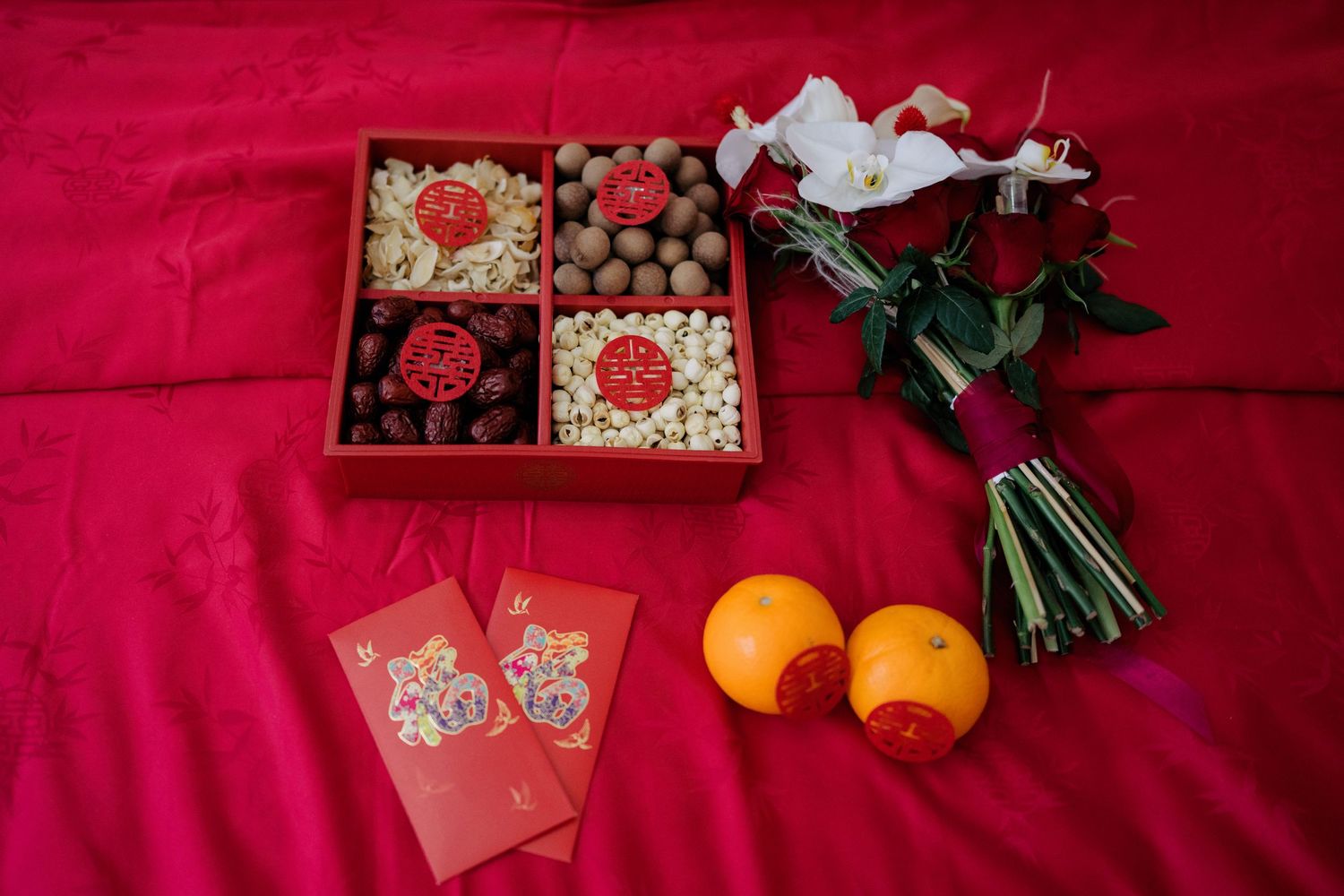Essential Chinese wedding traditions Guo Da Li  betrothal gifts including red dates, longans, and lotus seeds for a fertility blessing