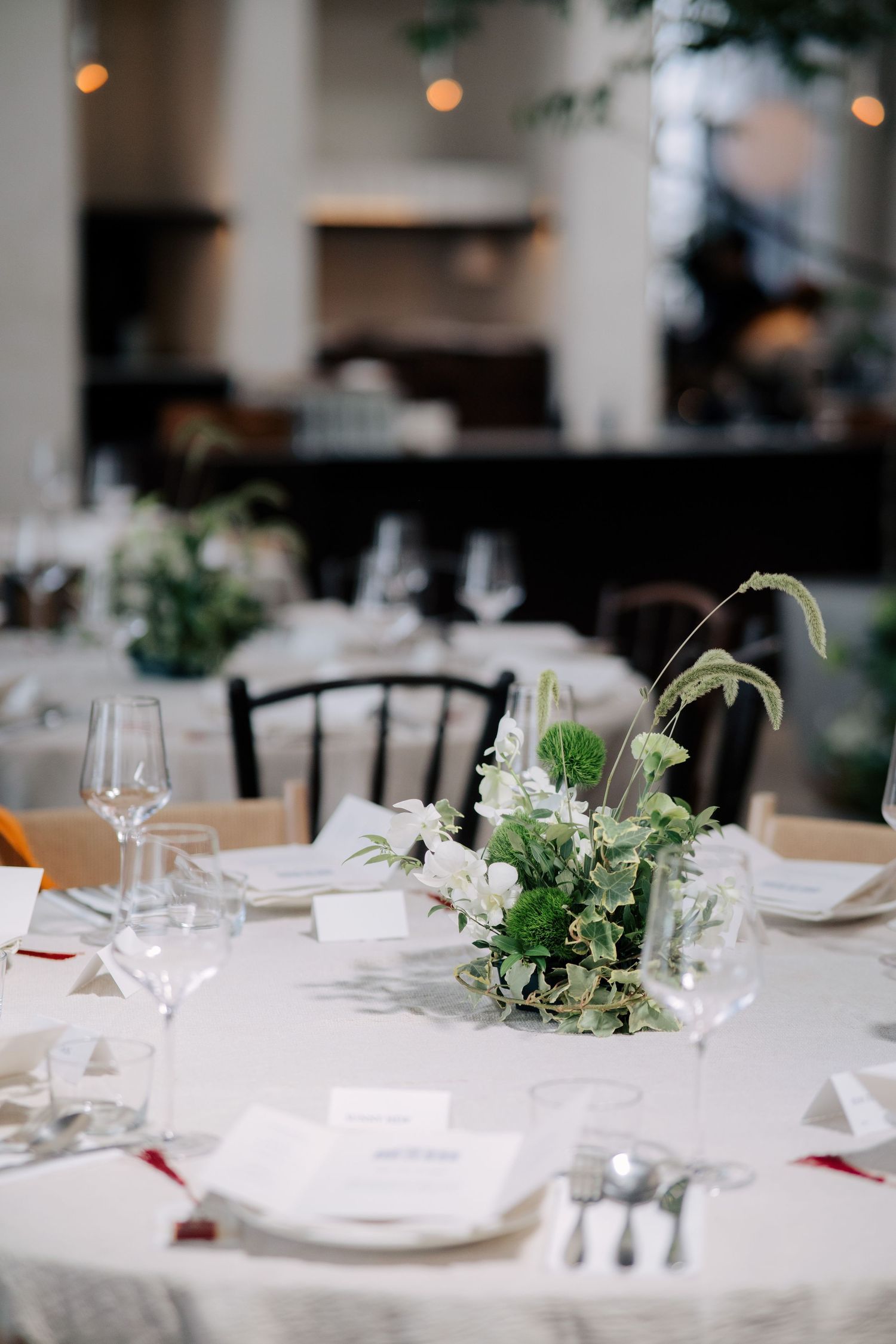 Elegant table centerpiece and place settings at a Peninsula House Penang wedding event