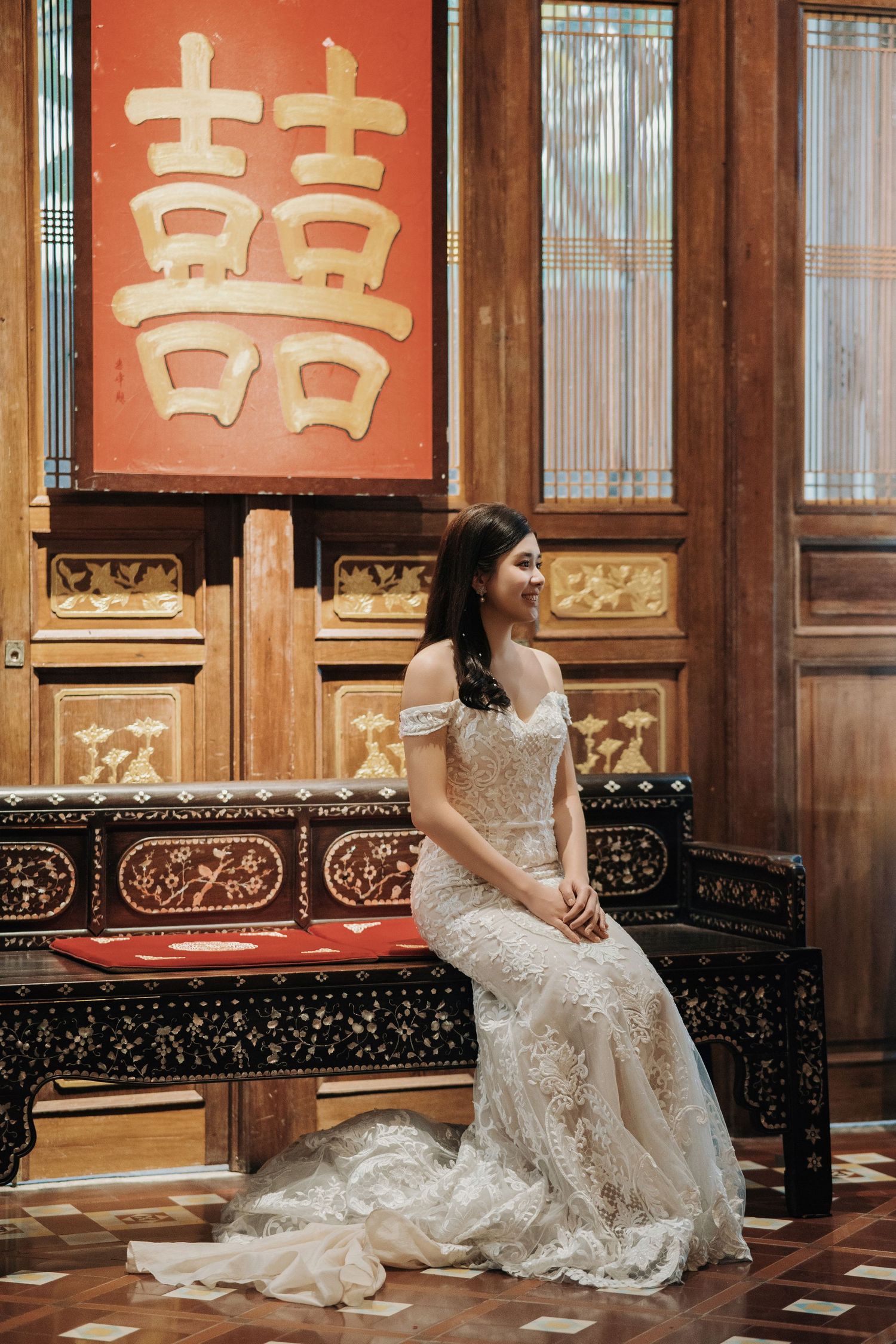 Portrait of a bride on a Peranakan bench during a Seven Terraces Penang wedding