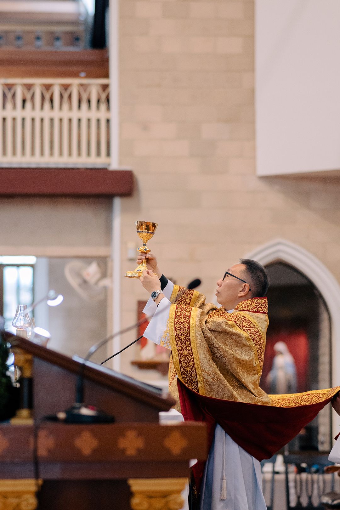 Elevation of the chalice during the Holy Eucharist at a Catholic wedding mass