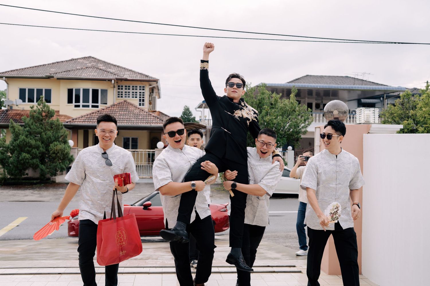 Groom's grand entrance for traditional Chinese wedding gate-crashing games and door challenges