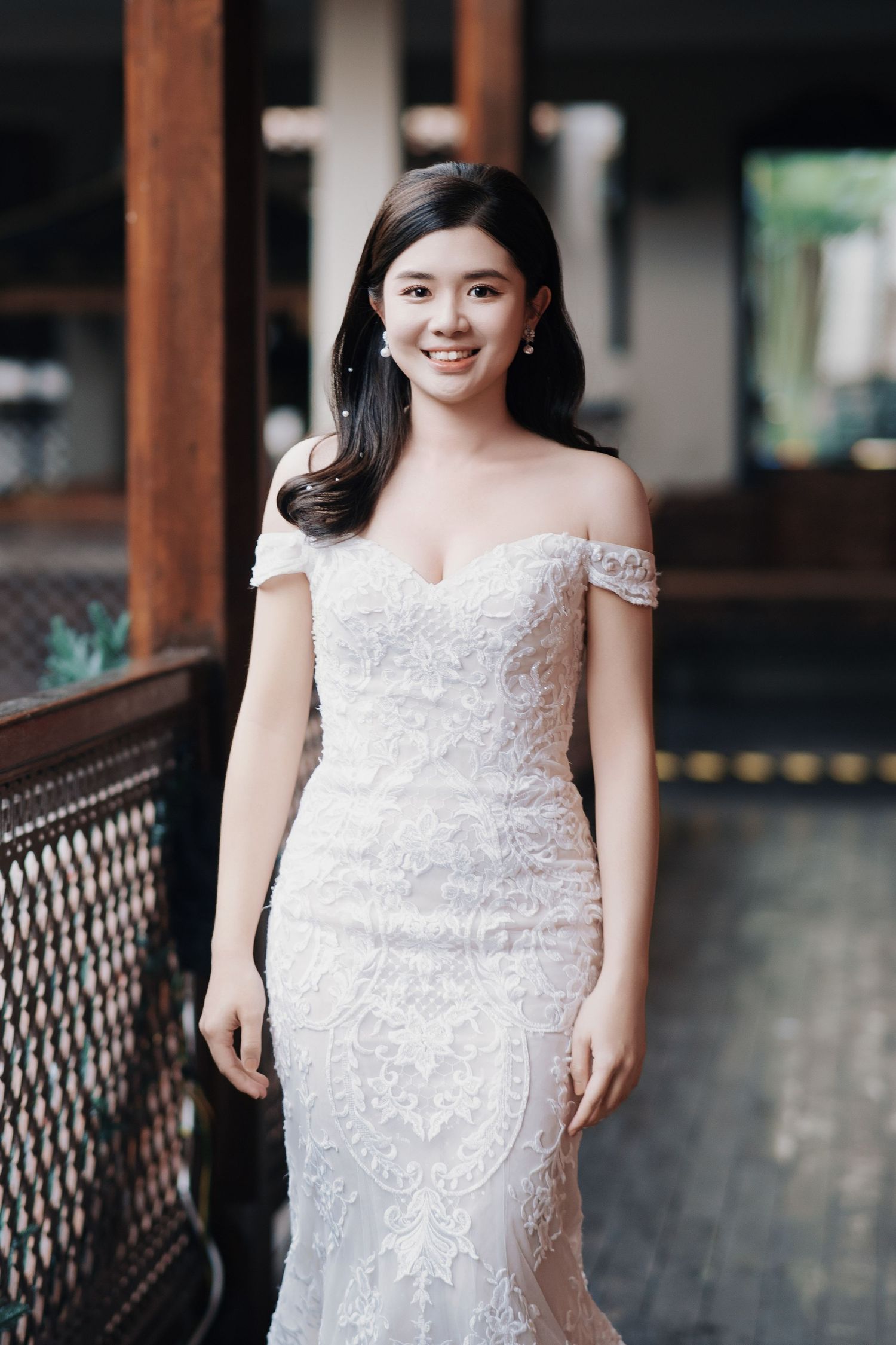 A bride showcases elegant Peranakan wedding style Penang on the historic balconies of Seven Terraces hotel