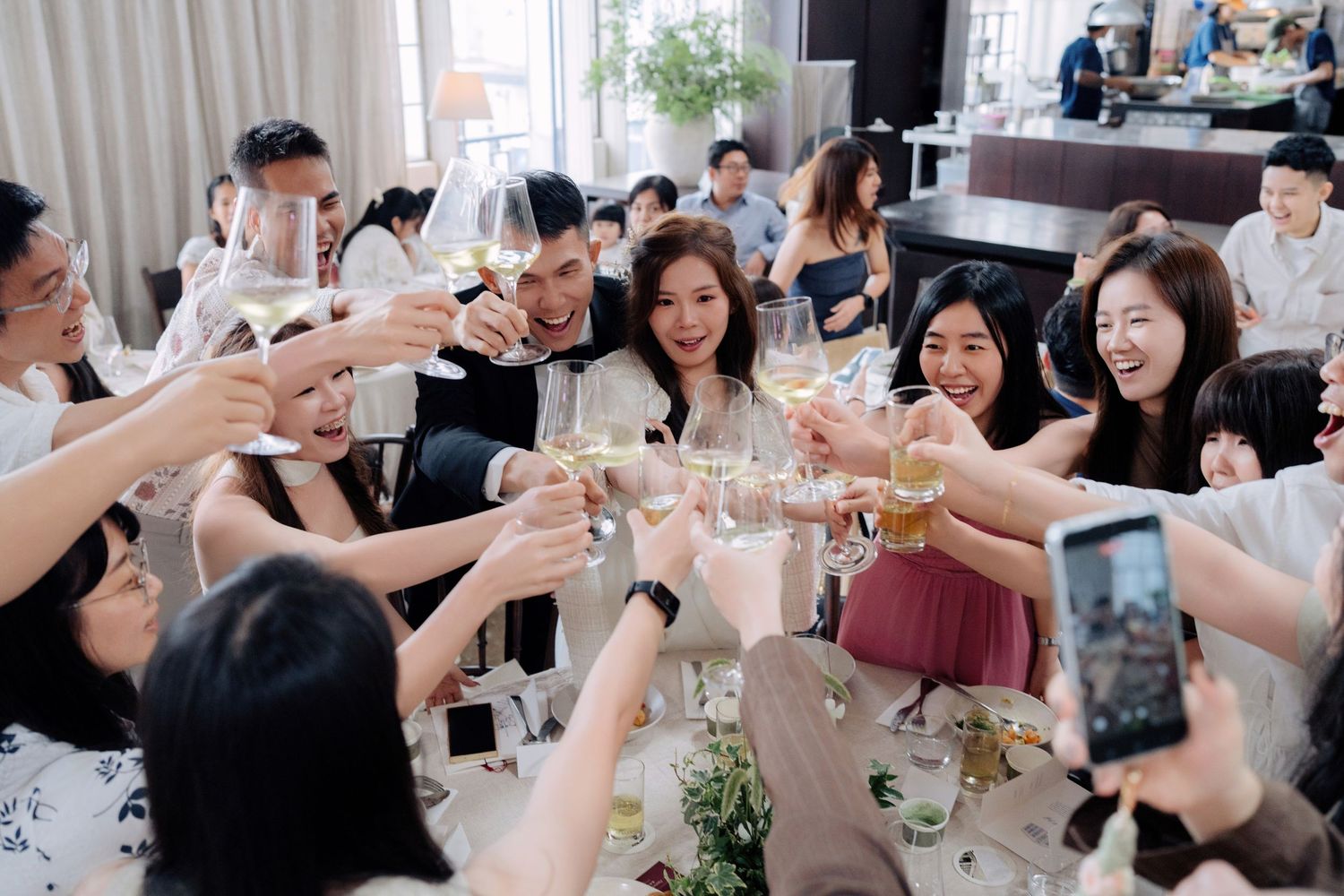 Celebration at Peninsula House, an intimate wedding venue in Penang featuring a warm dinner toast
