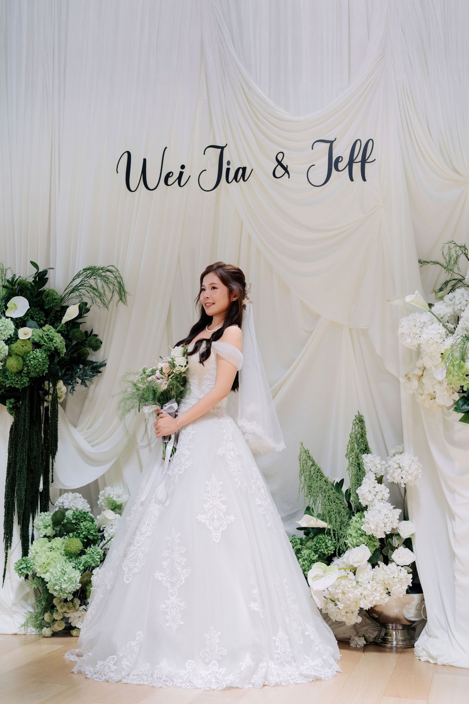 Bride Wei Jia posing in her wedding dress at Peninsula House, a premier Penang wedding venue