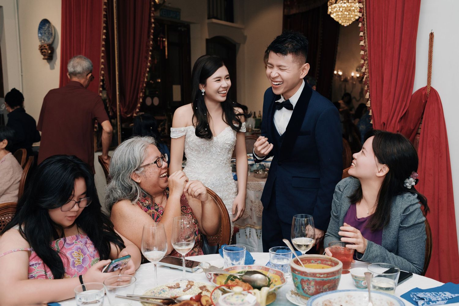 Joyful interaction between the couple and guests during a Kebaya Dining Room Penang