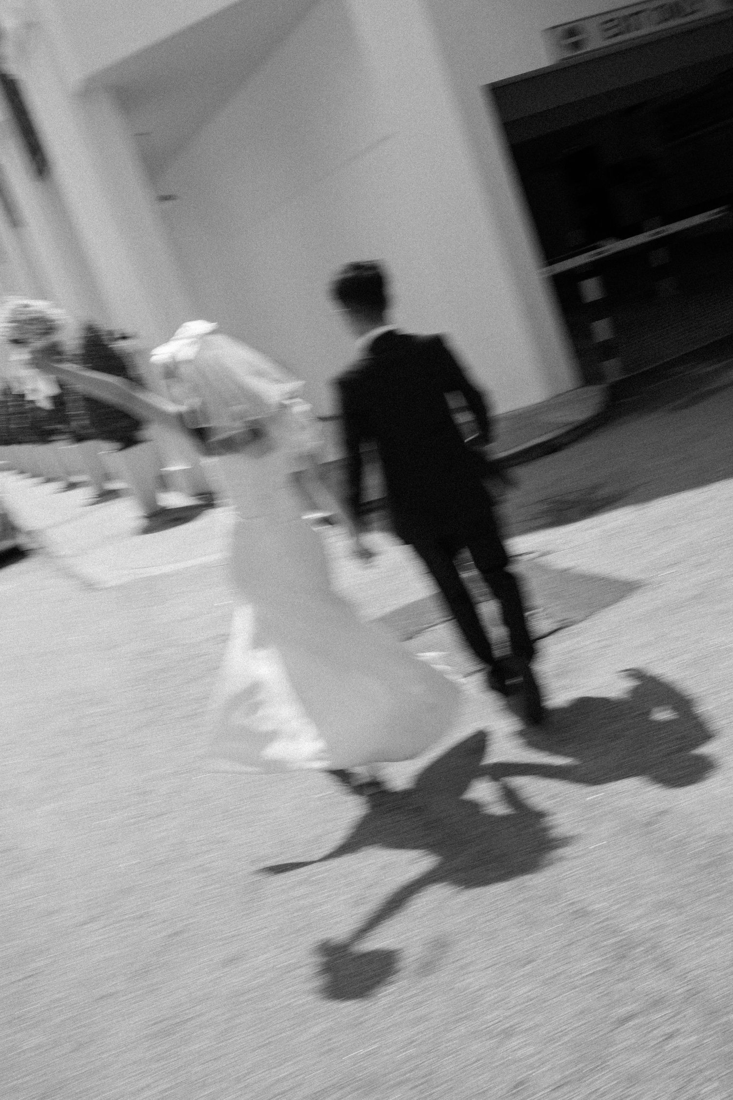 Blurry wedding photography trend featuring a couple in motion for an editorial, film-inspired aesthetic