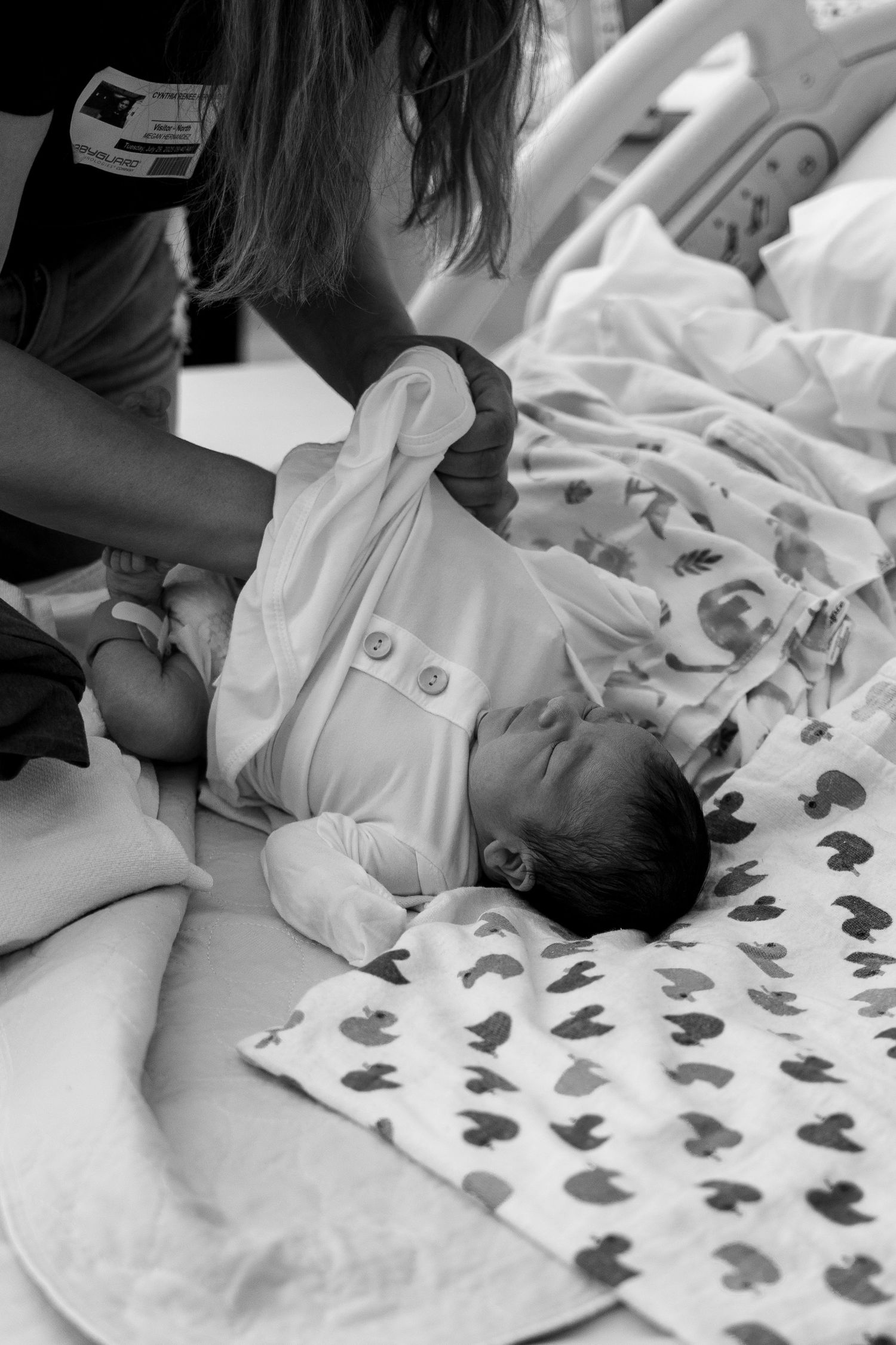 Newborn baby lying being dressed at Detar hospital in Victoria, TX.
