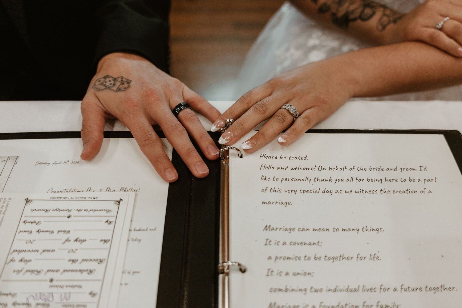 Wedding guest book pages with handwritten notes and signatures on white paper.