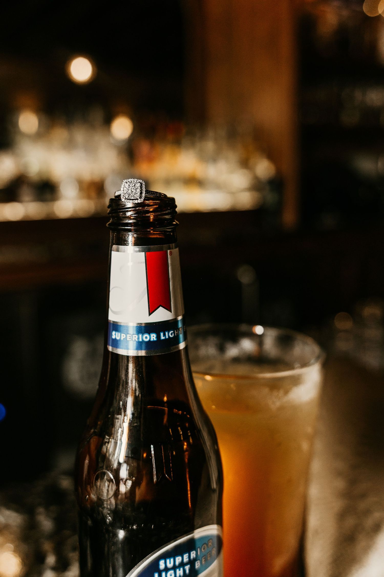 Close-up shots of beer bottles and cocktails on a dimly lit bar counter.