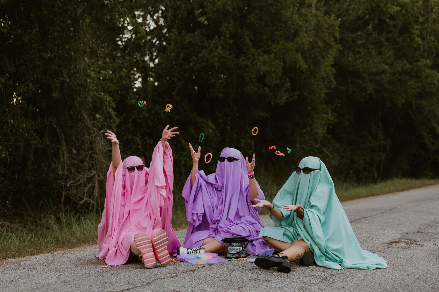Three Pastel ghosts in pink, purple, and mint green for Halloween.