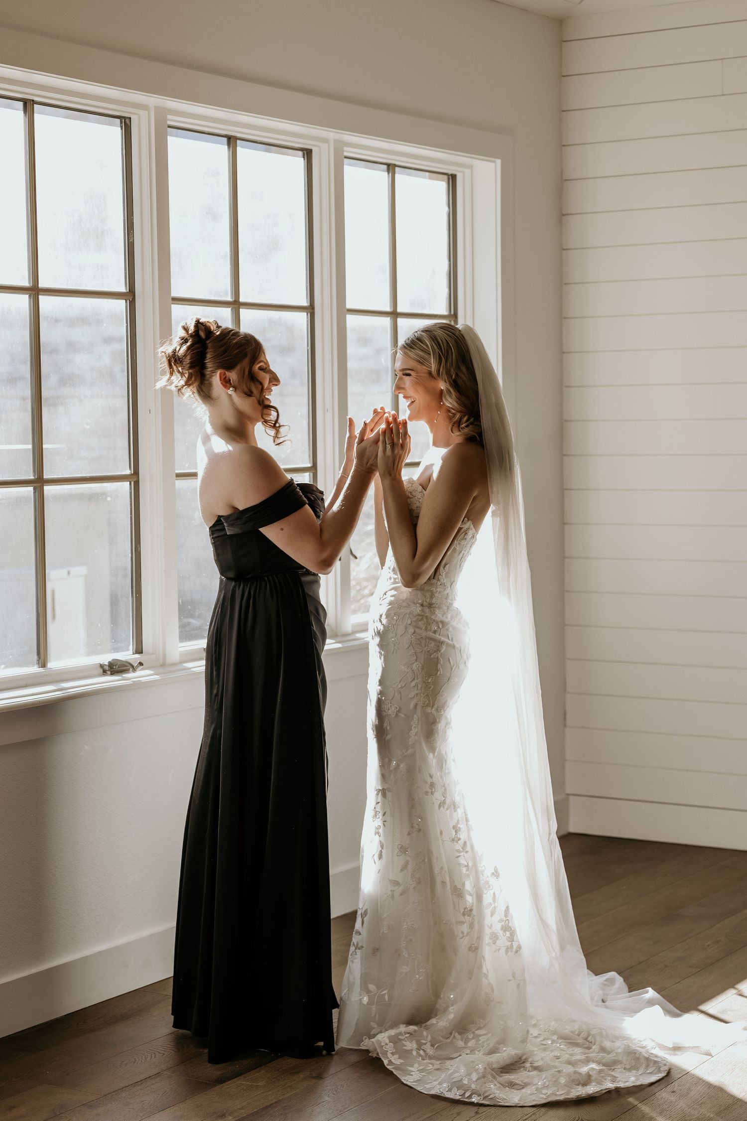 Austin, TX wedding Bride shares excitement with maid of honor.