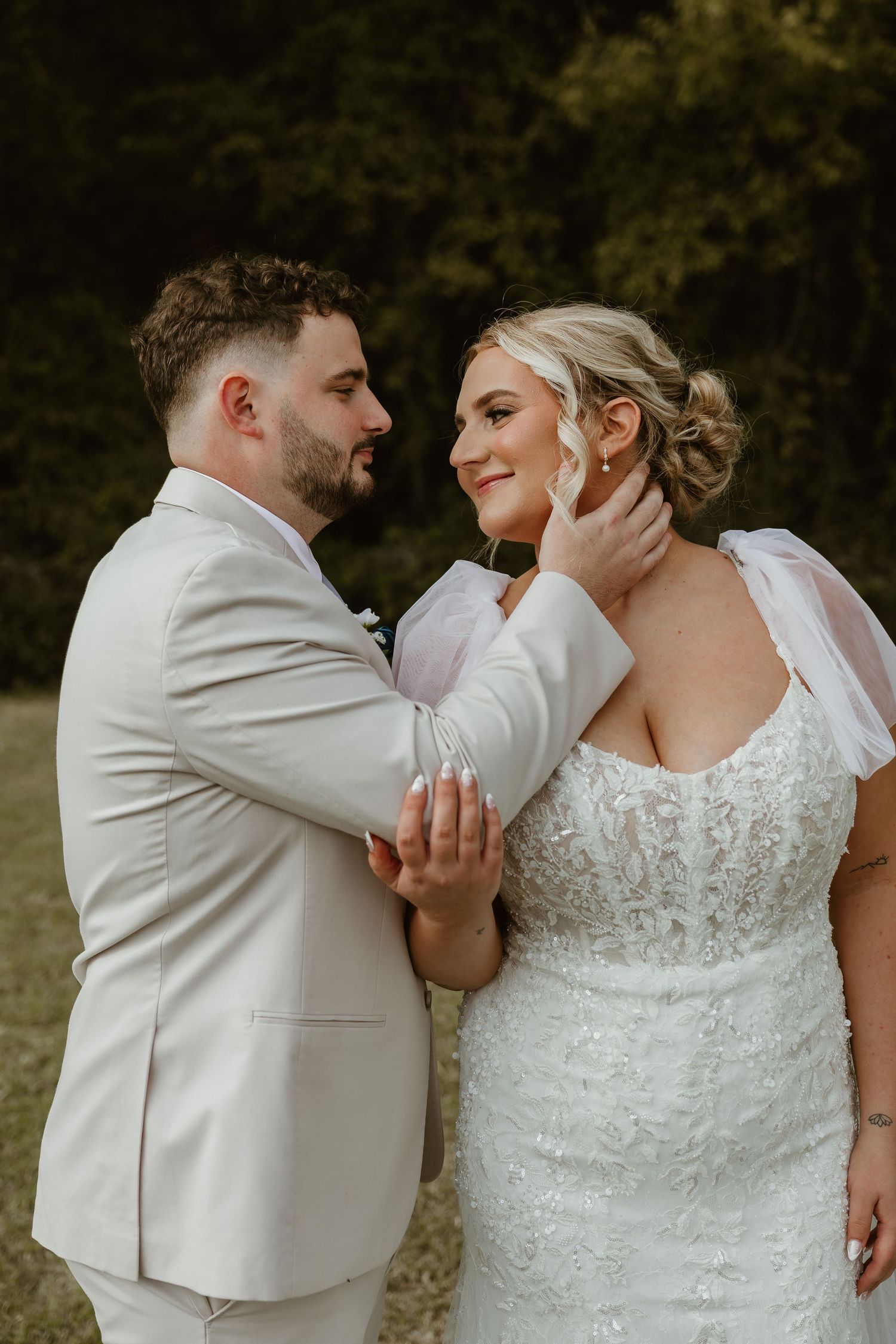 A romantic wedding photoshoot sequence showing a couple sharing a playful moment outdoors.