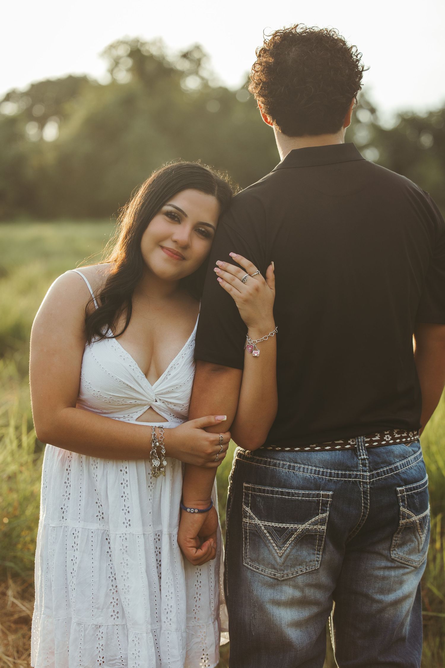 Close-up shots of couple's tender interactions in outdoor setting.