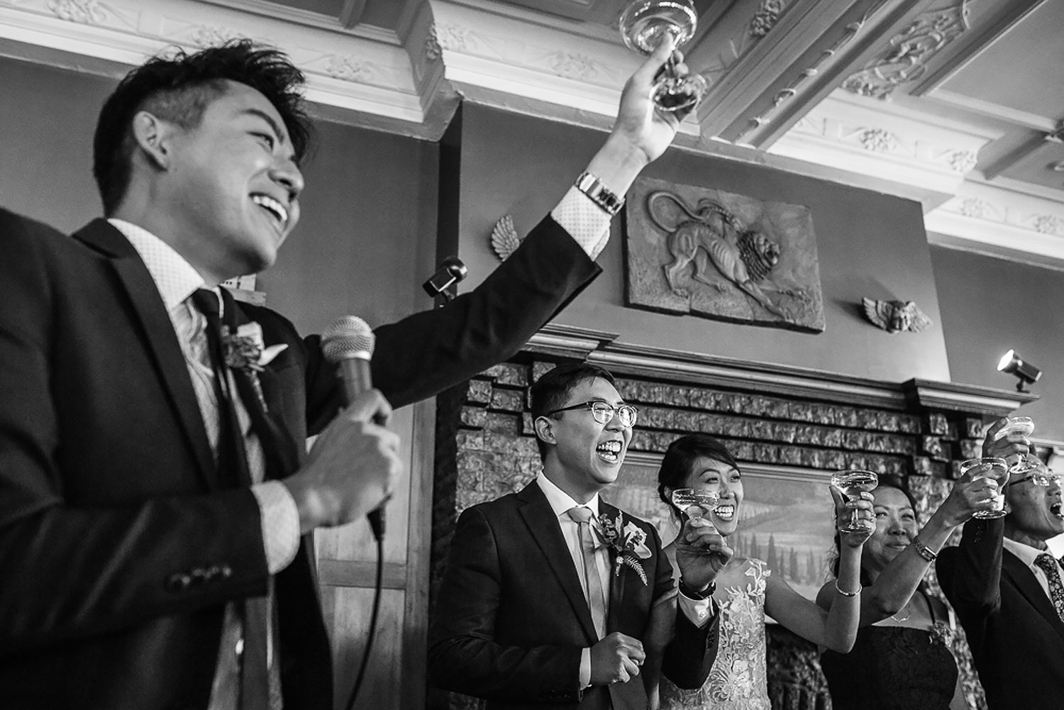 Wedding guests dance and celebrate during a lively reception in an elegant indoor venue.