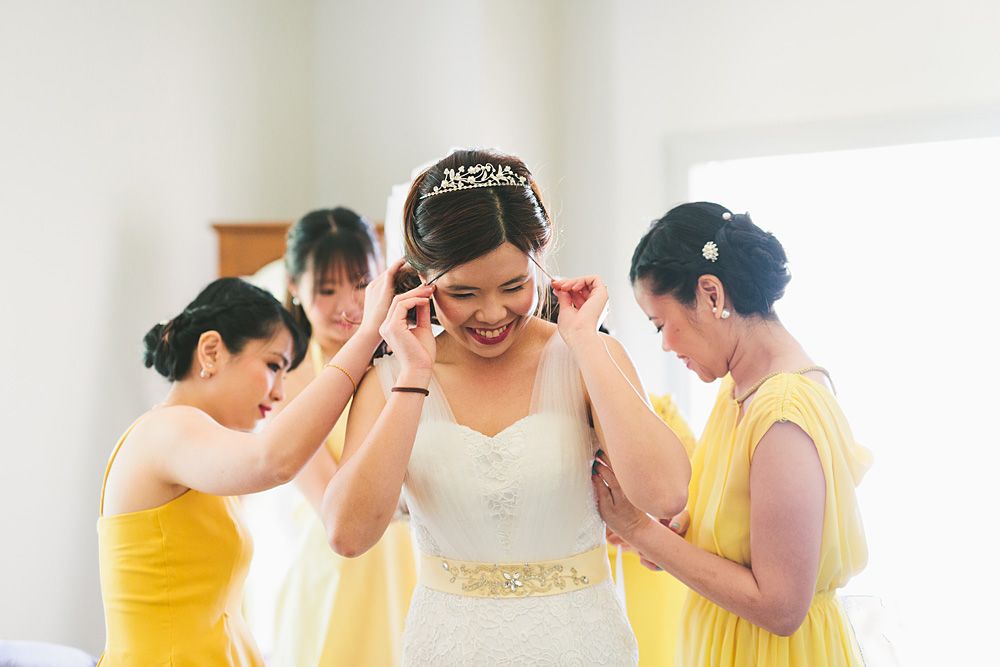 Bridesmaids in yellow dresses preparing for the wedding day.