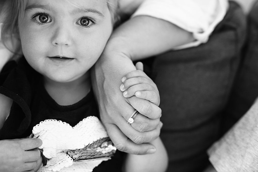 Black and white close-up portraits showing emotional family connections.