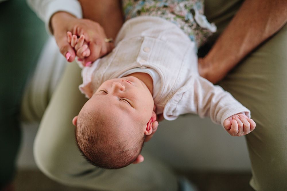 Close-up photos showing gentle interactions with a young baby.