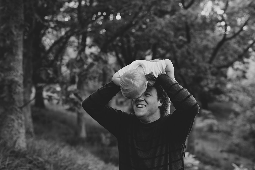 Candid black and white photos show playful outdoor moments.