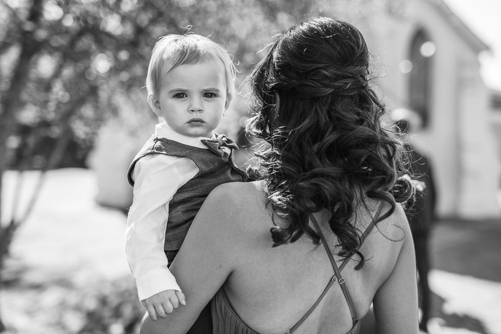 Candid moments captured during an outdoor wedding celebration.