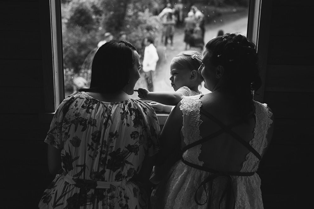 Wedding guests mingling during an outdoor reception at dusk.