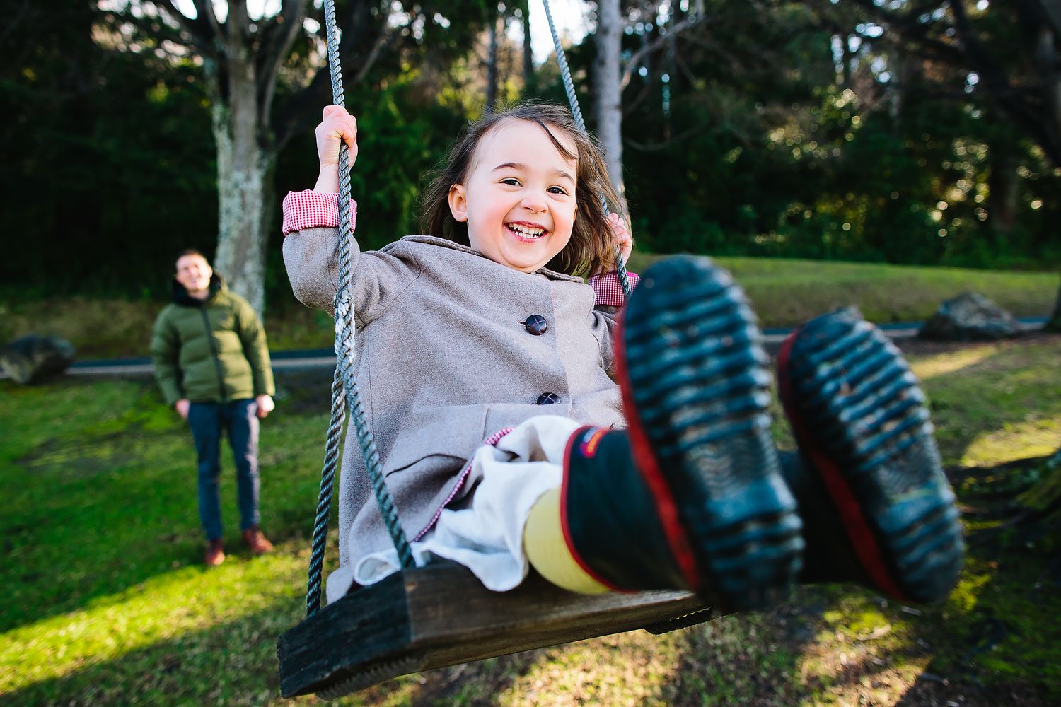 A sequence of outdoor playground scenes showing children playing and enjoying activities in a sunny park setting.