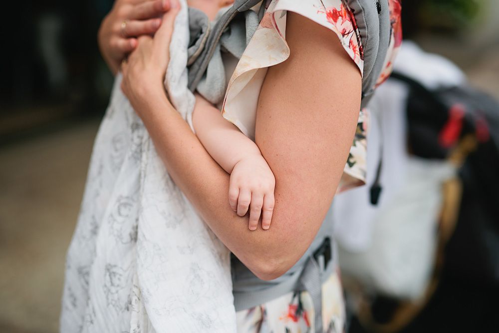 Close-up details of wedding attire and accessories in natural light.