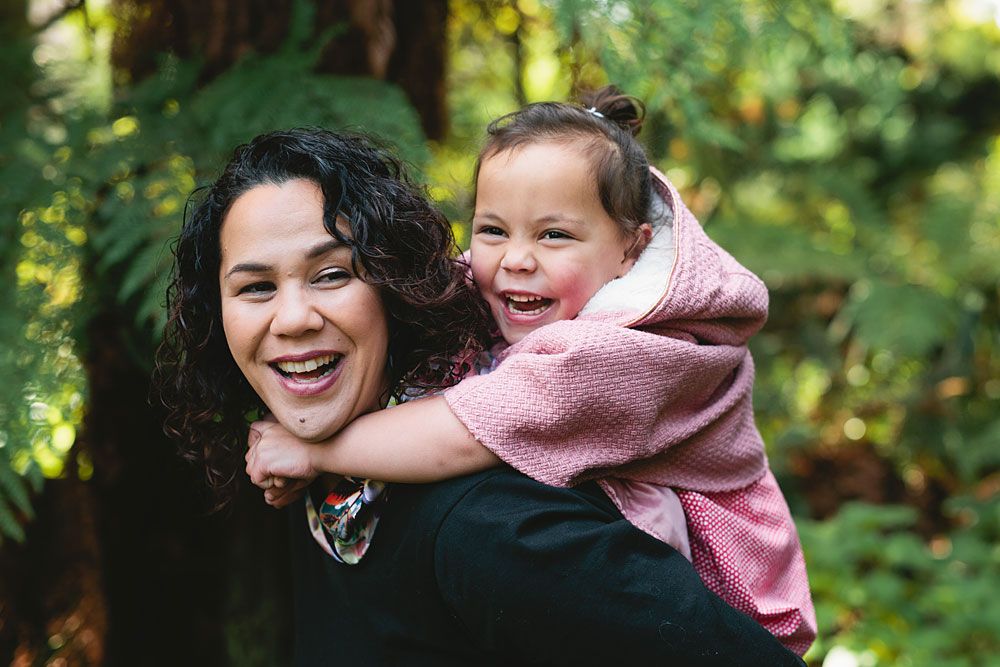 Joyful outdoor family interactions captured during golden hour in a natural setting.