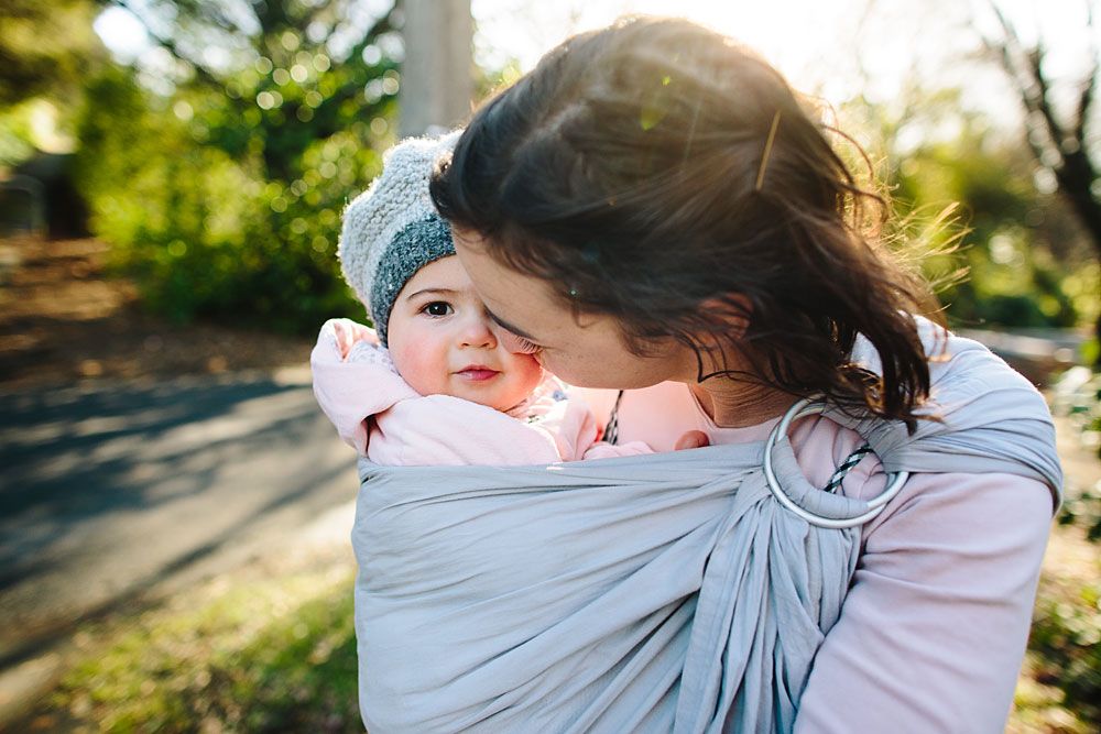 Gentle embraces and connections captured in soft natural lighting outdoors.