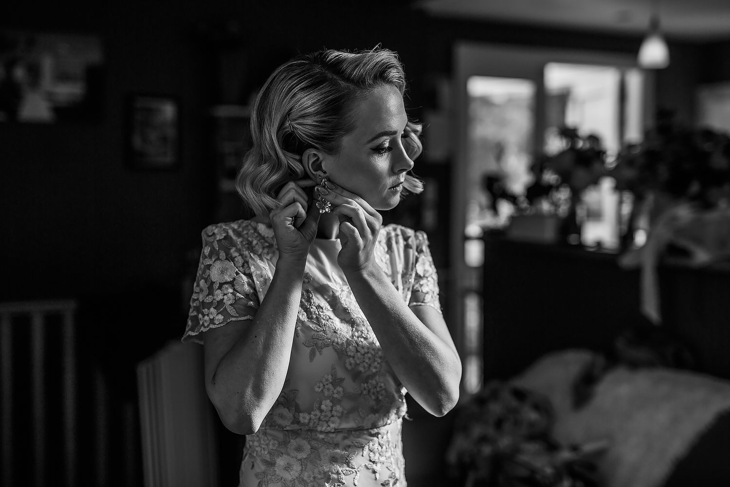 Wedding party shares joyful laughter and embraces during celebration.