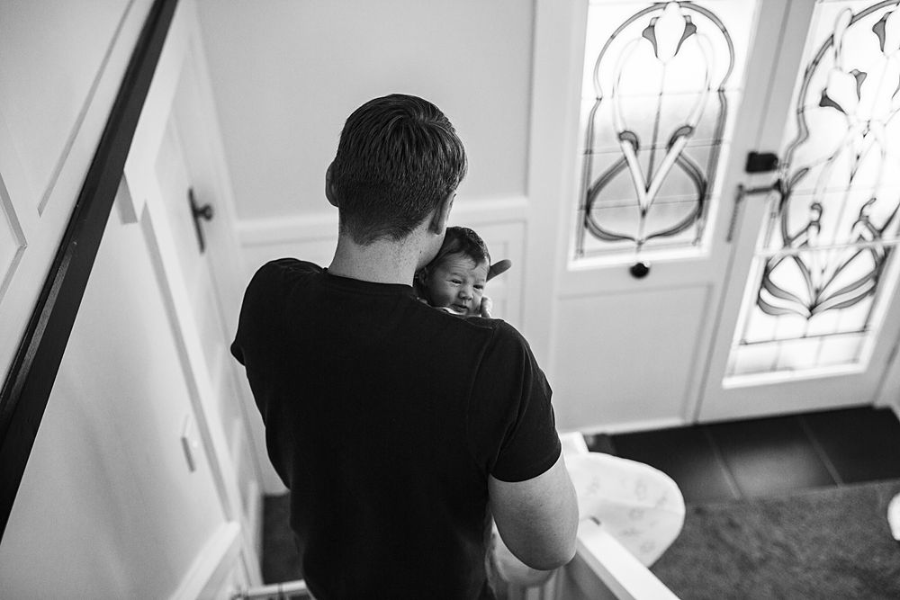 Black and white photos showing intimate reading moments by a window.