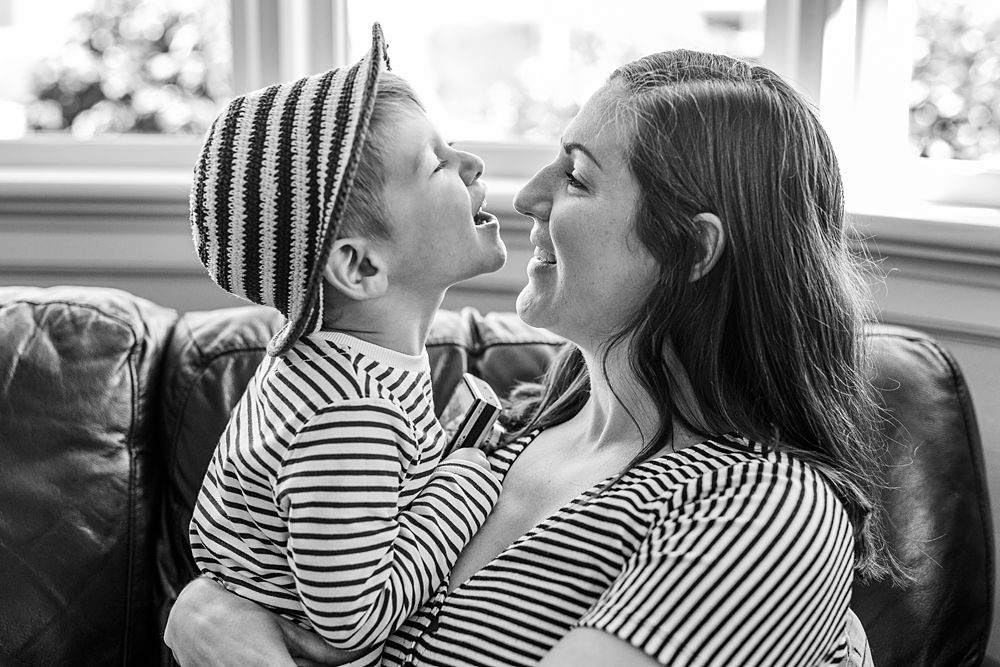 Series of tender moments between family members wearing matching striped clothing.