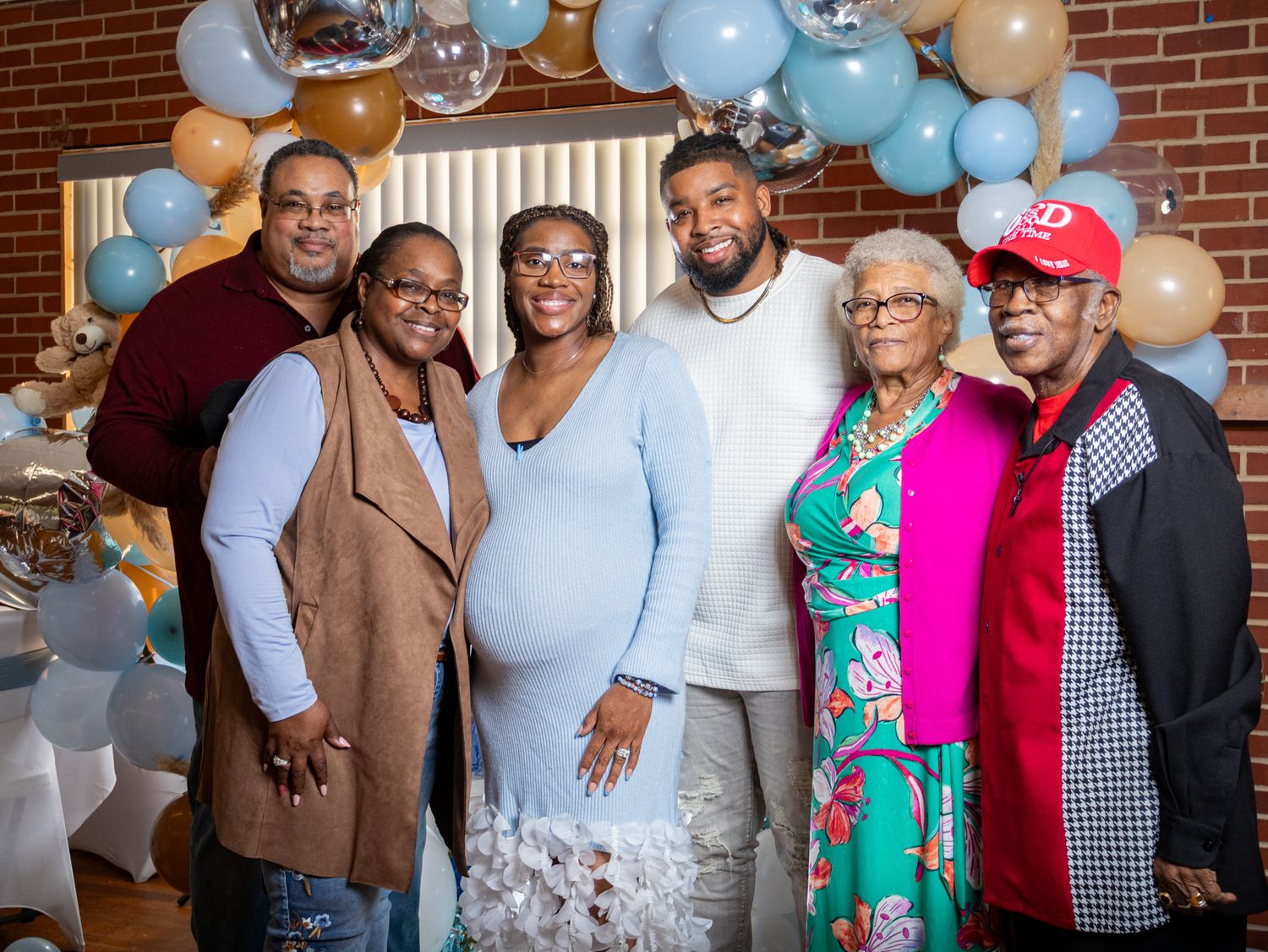 The Parents around their family at their baby shower by Zmoovy Milestones