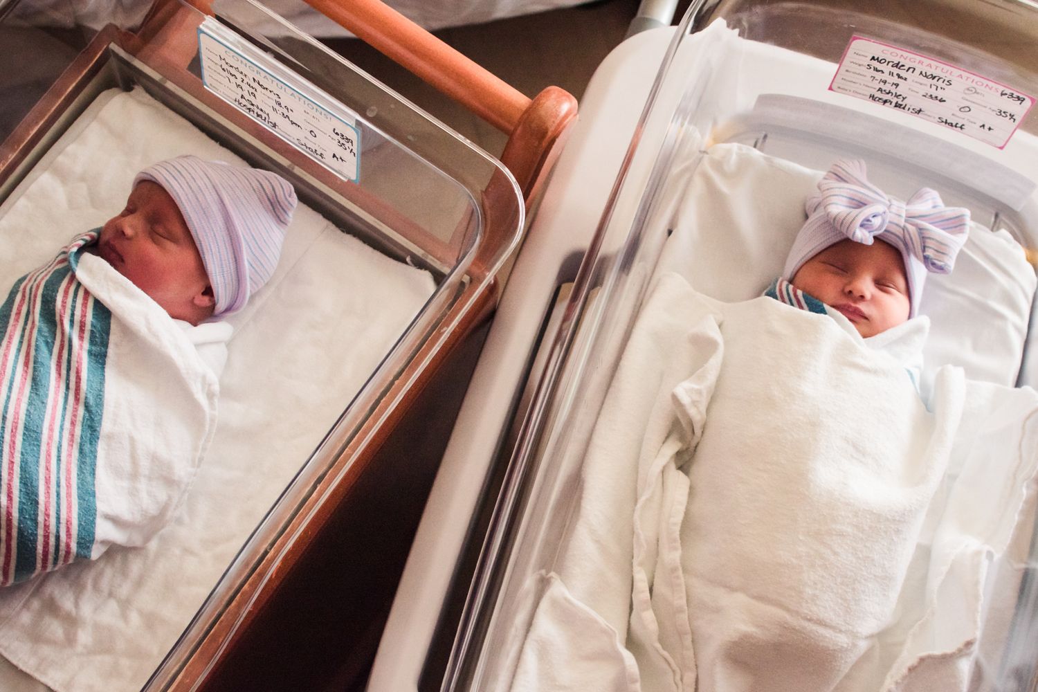 Fresh 48 birth photography of newborn twins resting in incubators at Corewell Health in Troy, Michigan, bathed in soft morning