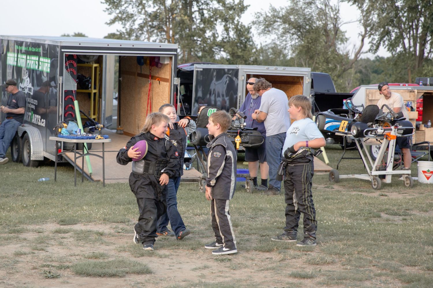 Multiple people practicing self defense techniques in an outdoor training environment.
