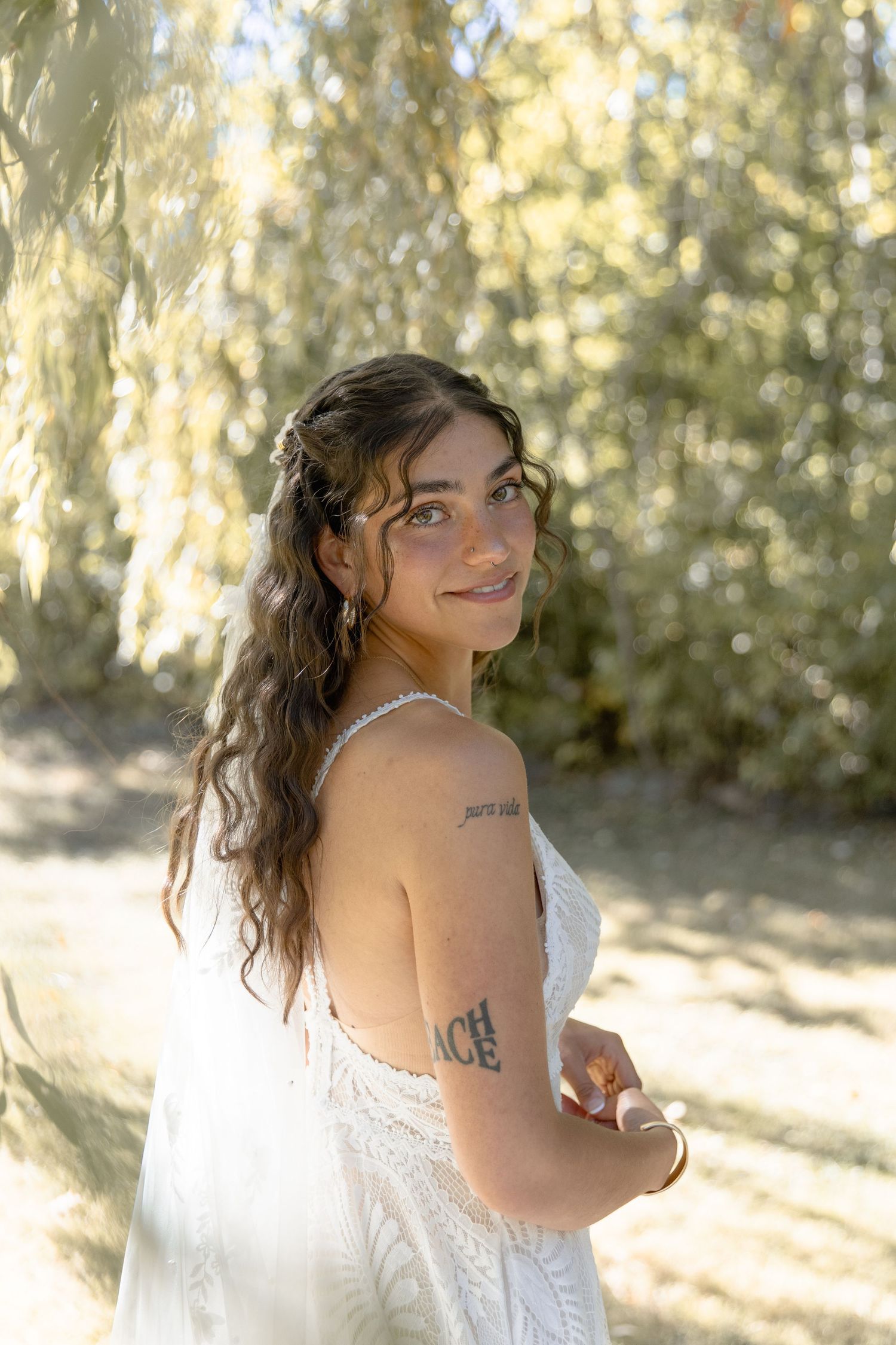 A series of romantic outdoor bridal portraits in a white dress with sunlit trees creating a dreamy backdrop.