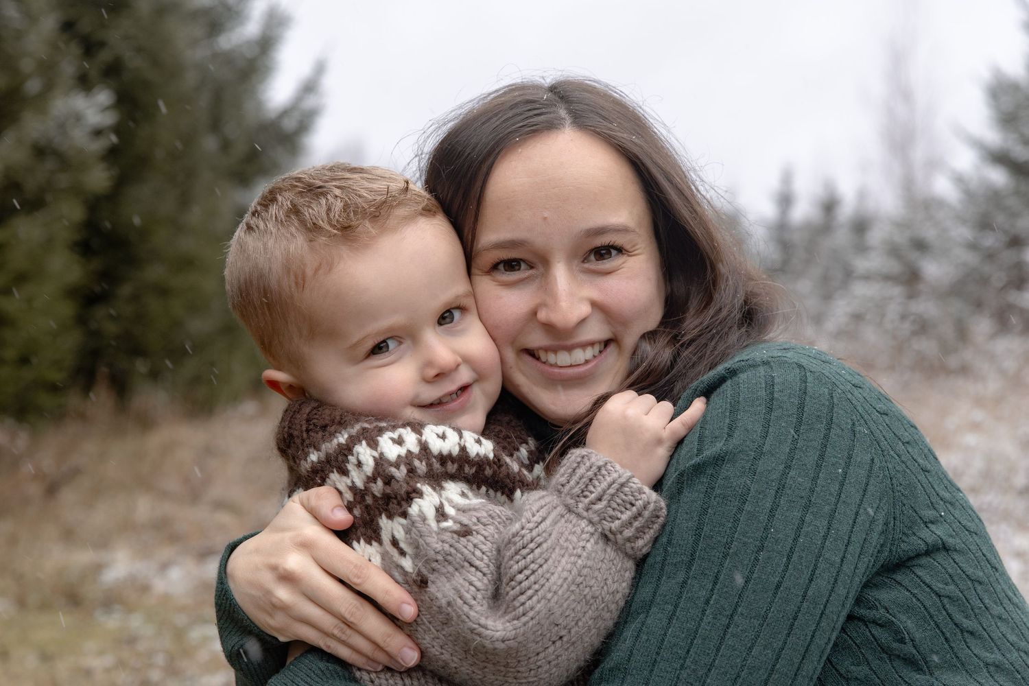 A series of intimate outdoor family portraits showing affectionate moments between parent and child in winter scenery.
