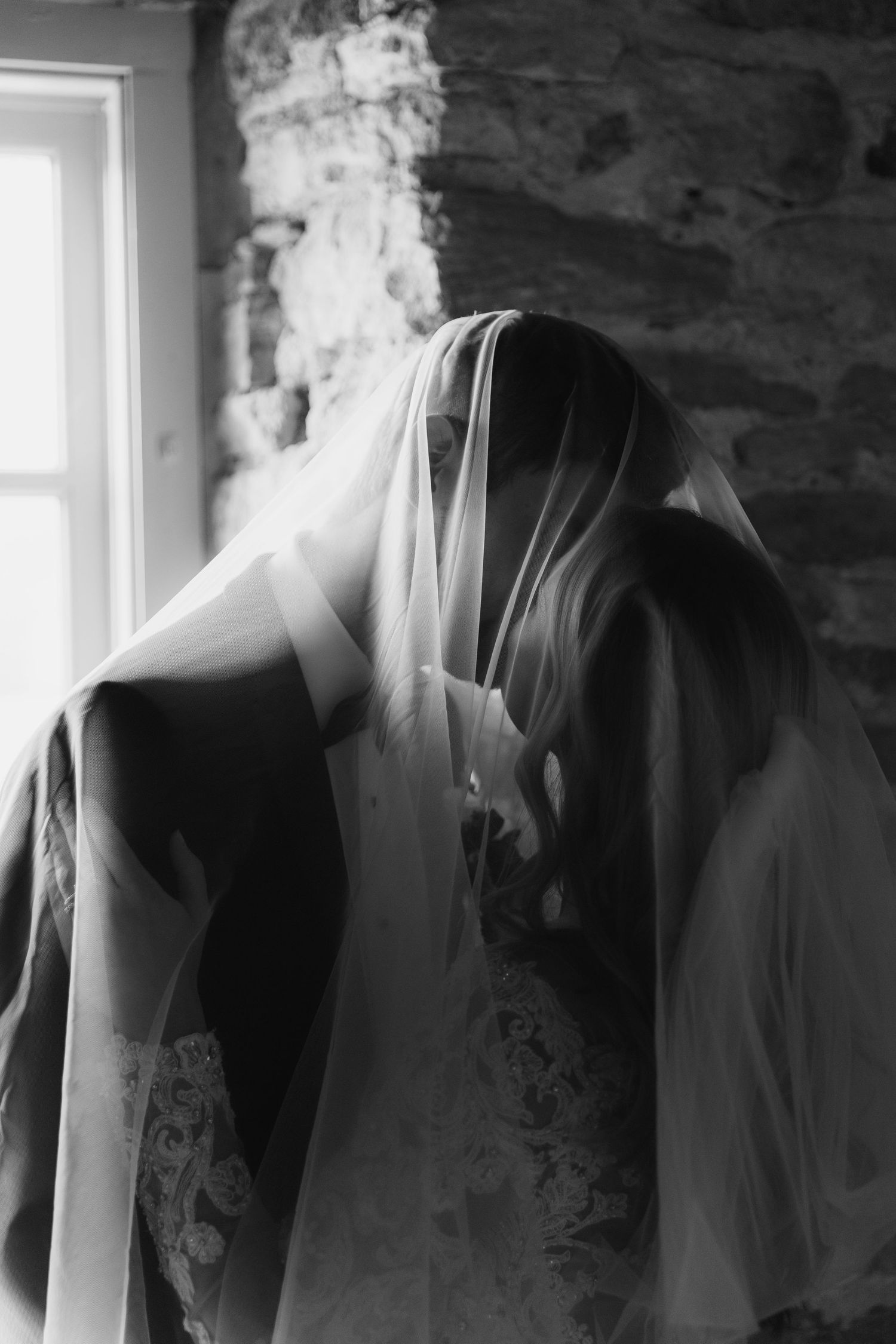A black and white artistic photo series showing a blurred figure in motion against a window backdrop.