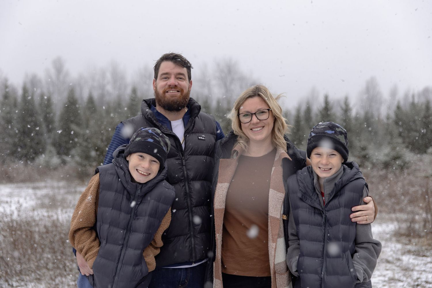 A series of winter outdoor portraits showing people bundled up in puffy coats and winter gear against a snowy backdrop.