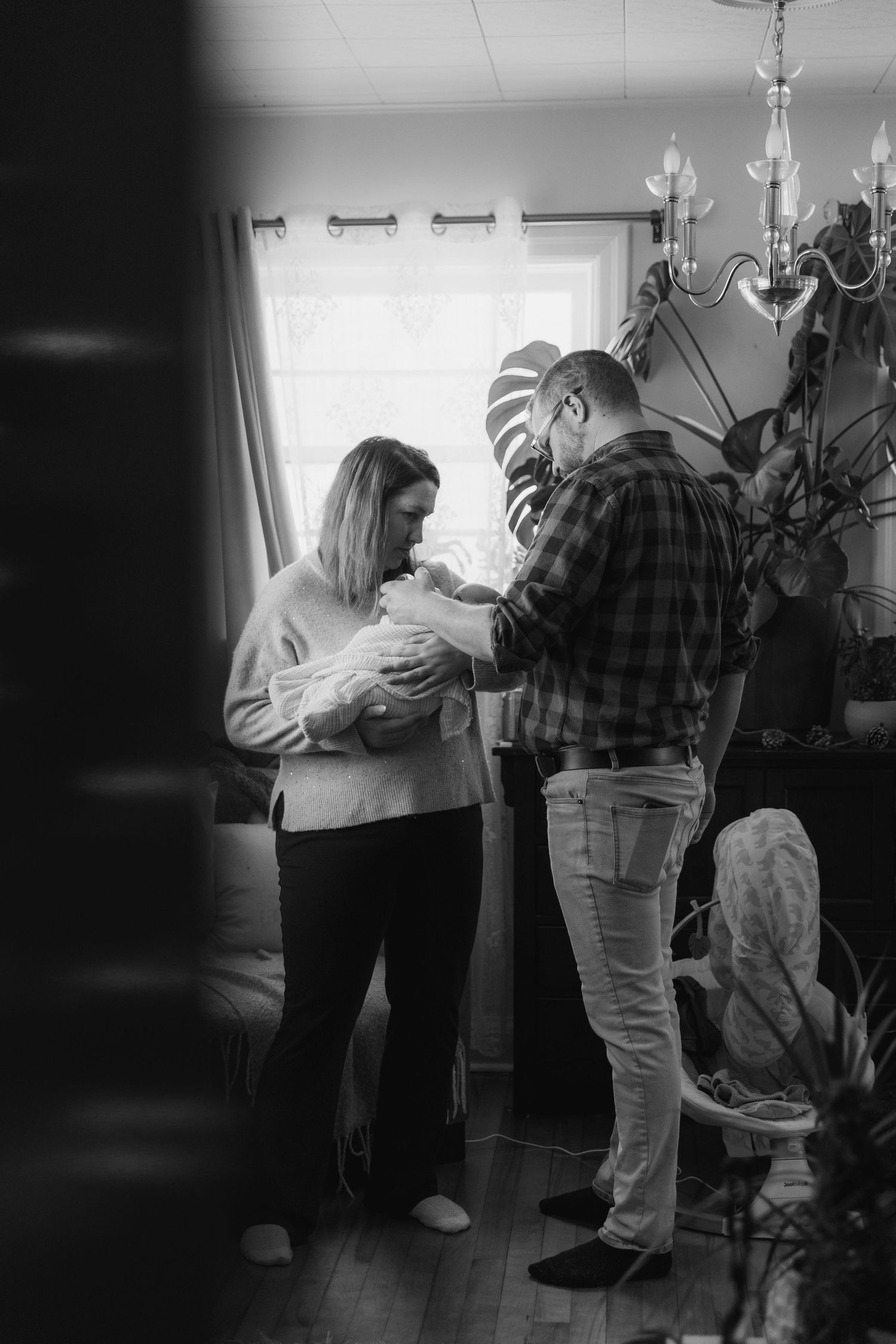 A series of black and white photos showing people dancing together in a dimly lit room.