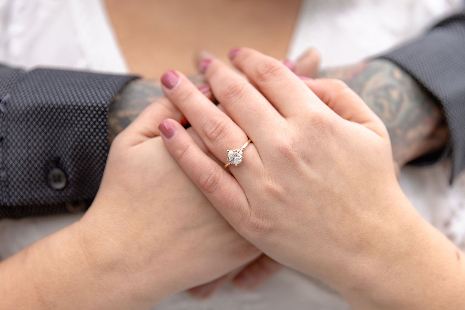 Close-up view of hands holding each other showing support and comfort.