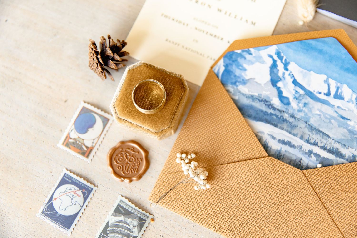 Vintage letters and postage stamps arranged on brown kraft paper with wax seals and decorative elements.