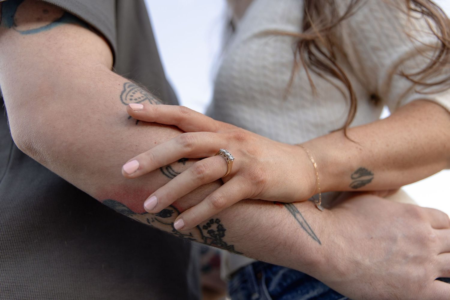 Close-up view of hands applying moisturizer or lotion in a gentle massaging motion.