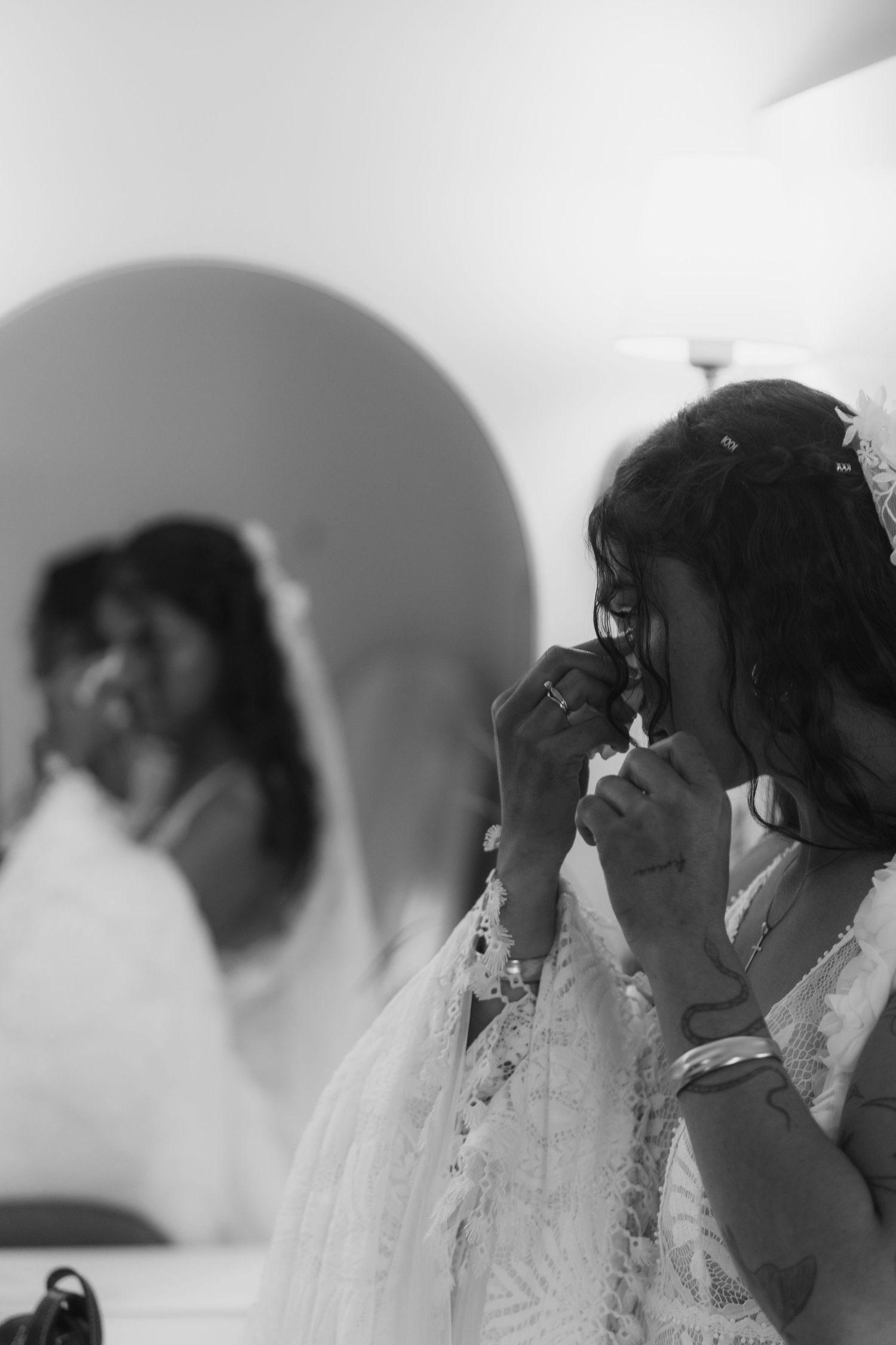 A black and white artistic photo series showing the same bride in different emotional moments during her wedding day.