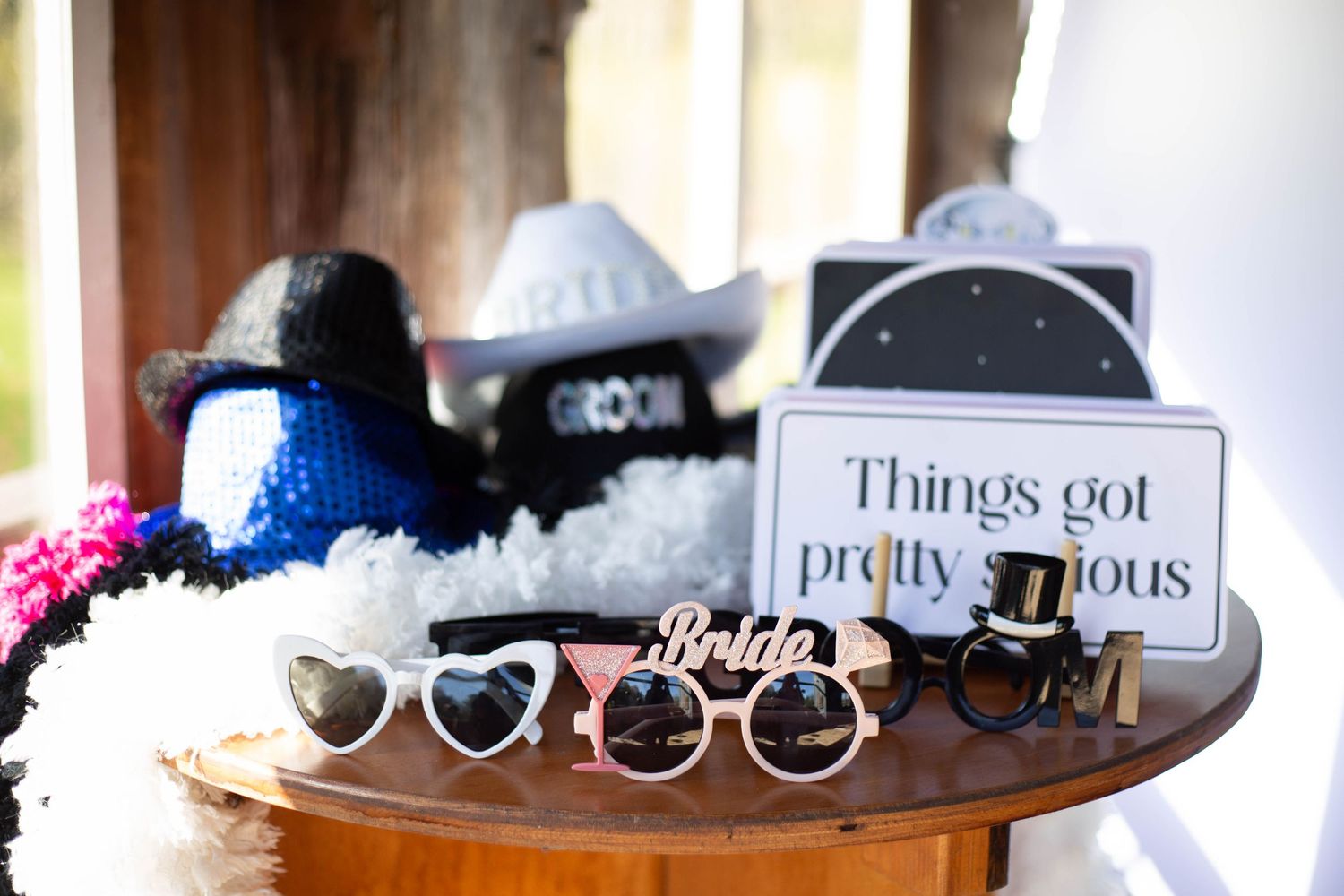 A collection of stylish sunglasses displayed in a row on a white surface.
