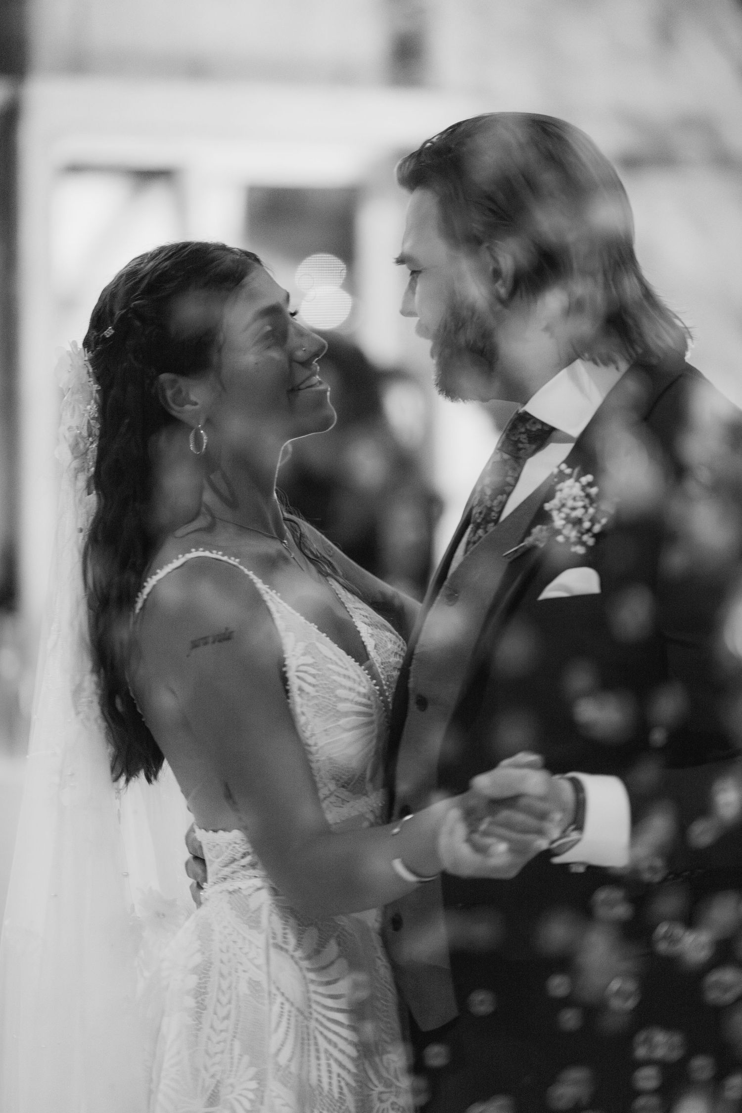 Four sequential photos showing a bride and groom sharing their first dance at a wedding reception.