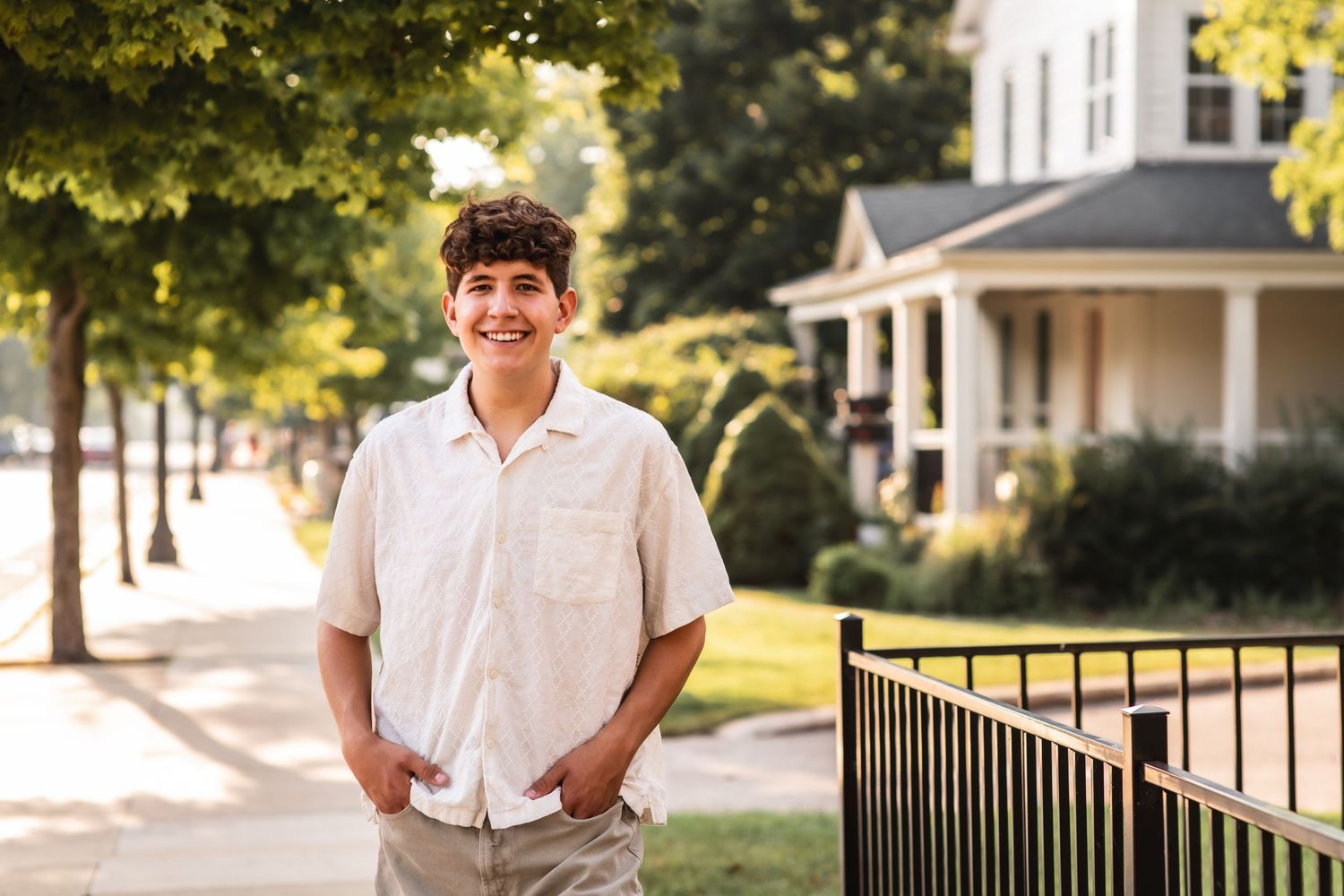 Senior portrait of a boy posing in downtown Holland, MI.