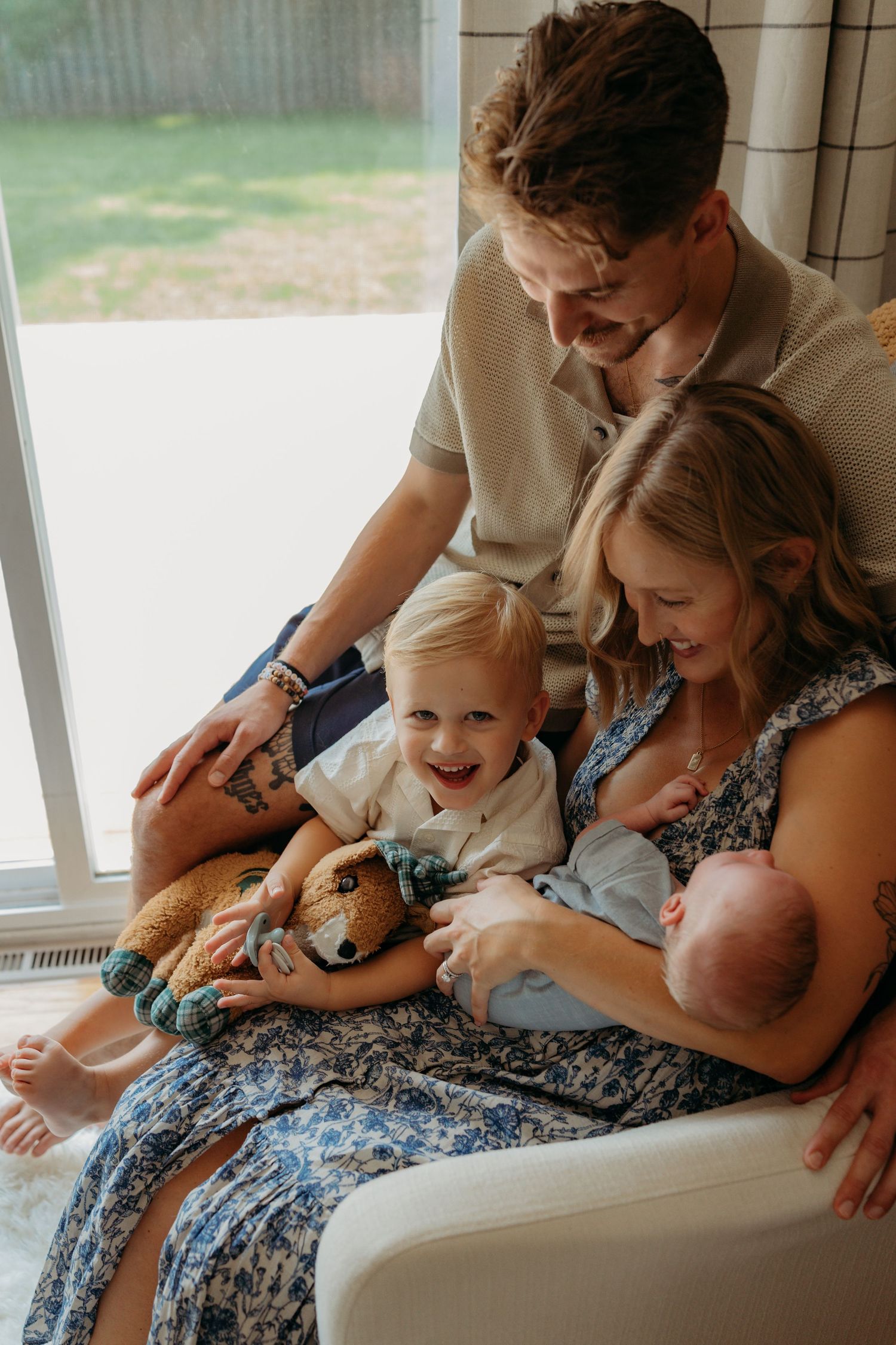 A series of candid family moments showing tender interactions between parent and child on a couch by a window.