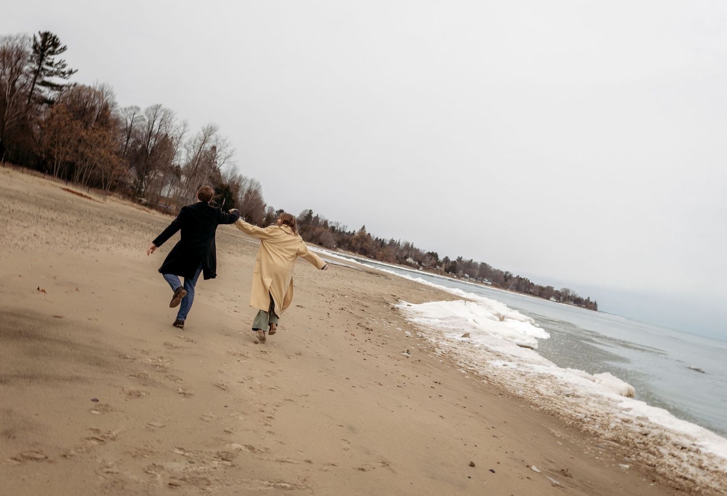 A sequence of photos shows someone walking along a snowy winter beach with waves crashing against the shore.