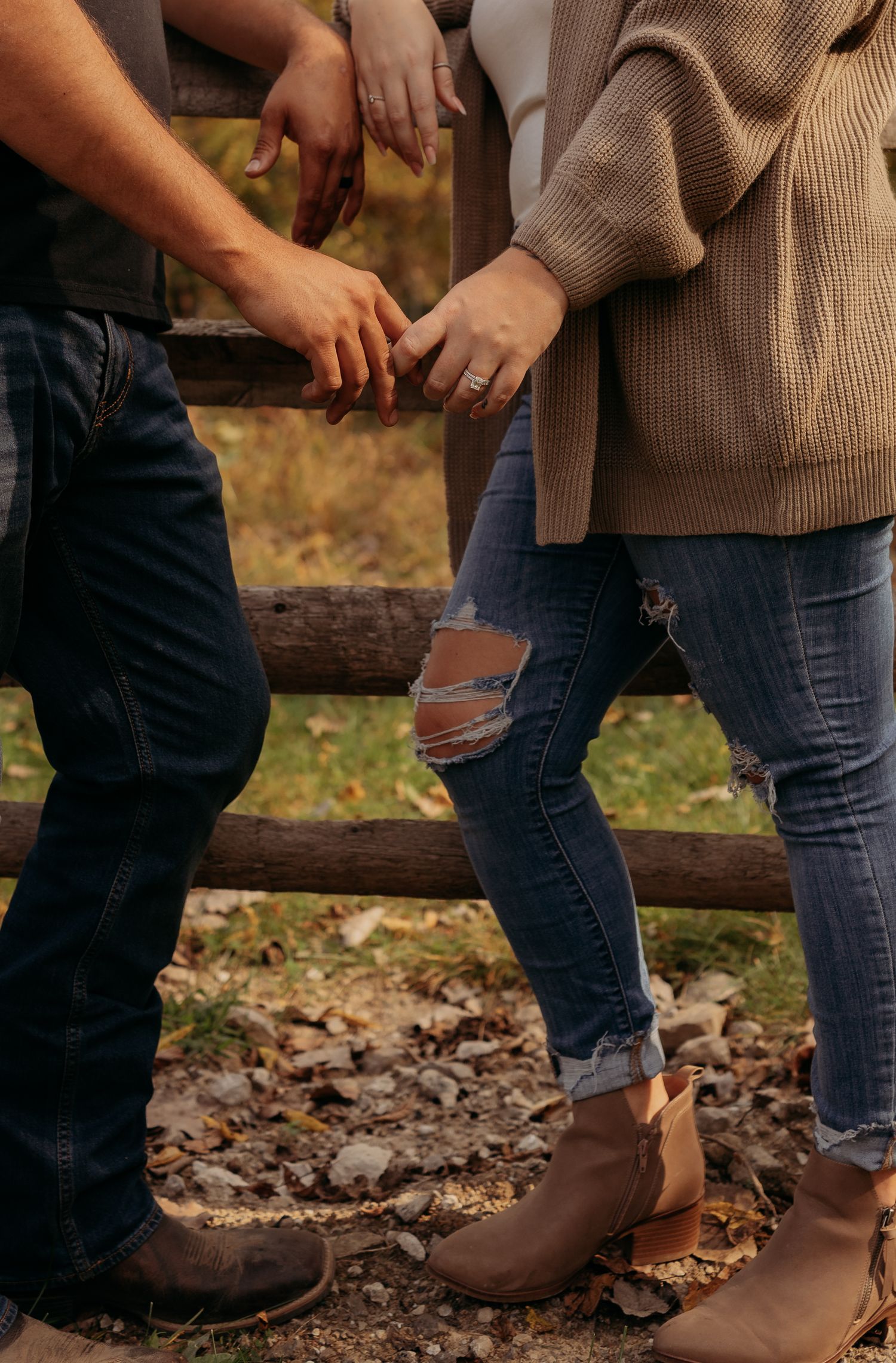 Close-up series of brown leather boots and ripped jeans walking on autumn leaves in a rustic outdoor setting.